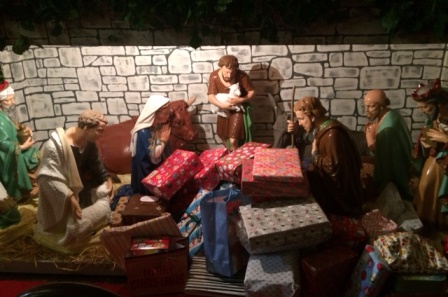 Children Donate Gifts to Crib at Carol Services