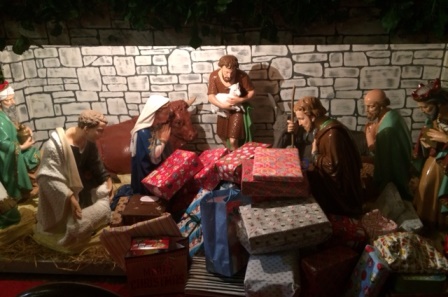 Children Donate Gifts to Crib at Carol Services